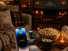 Warm cozy bedroom with a dark wood bed, cream and beige layered bedding, lace curtains, soft lighting, books, flowers and a compact white 3-in-1 wireless charger placed naturally on the windowsill.
